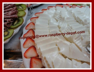 Decorating a Cheese Tray by Garnishing it with fruit